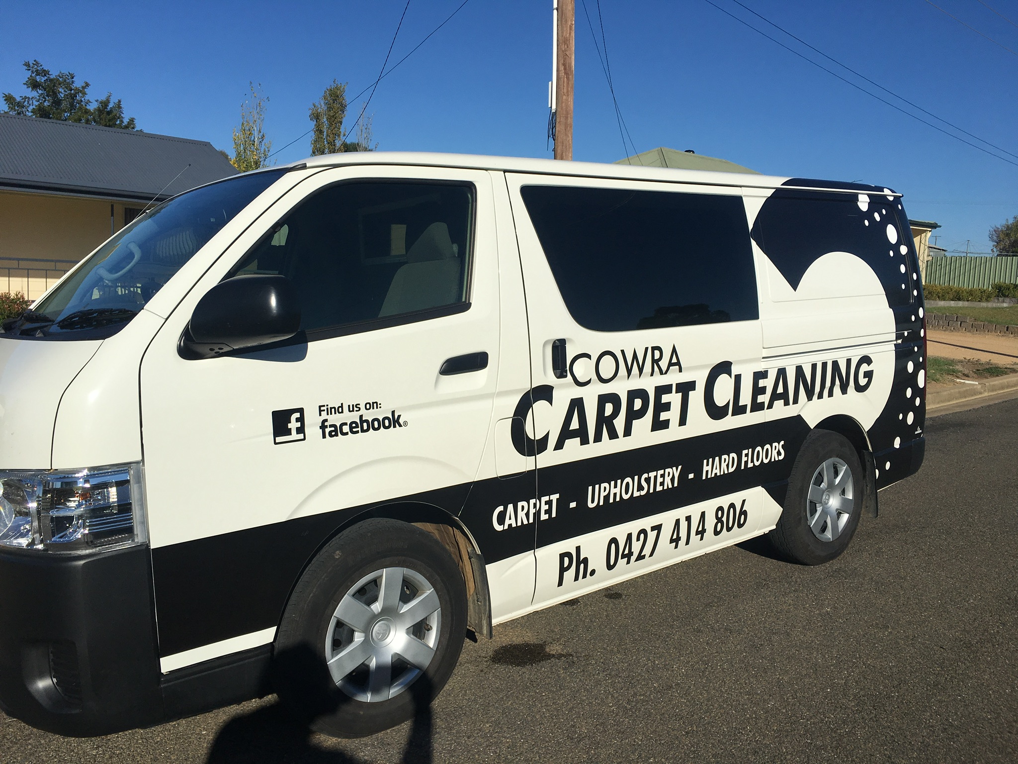 The Cowra Carpet Cleaning van, white with black livery, parked on a Cowra street